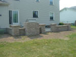 Hardscaped patio and walls in Greece NY. Made by Aaron of Landscape Solutions.